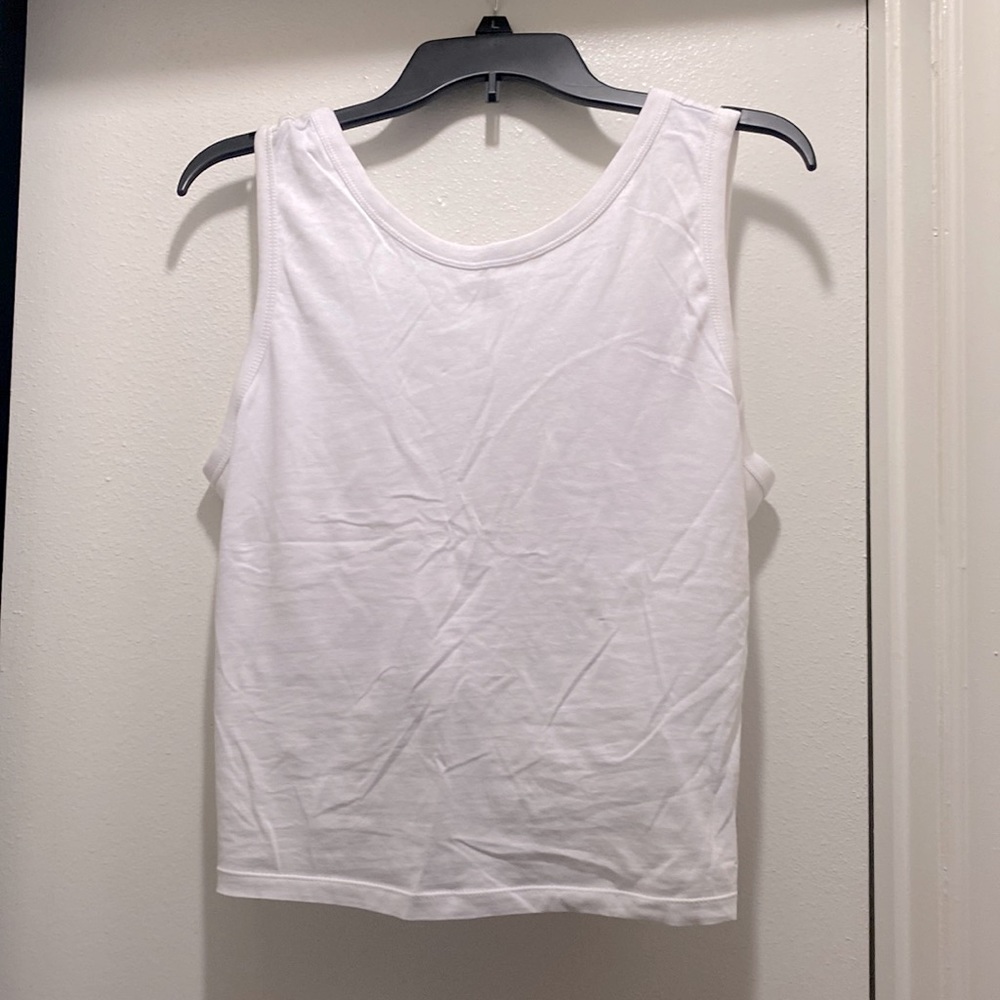 Levi’s crop top with a deep v twist back. Size L. Never worn original tags.